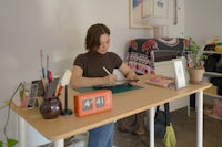 a woman sitting at a desk